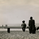 Woman and child on bench, Black Sea, Russia