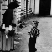 Woman showing a kitten to boy,  Leningrad, Russia, 1957