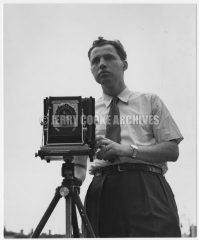 Jerry Cooke with camera on tripod, 1940s