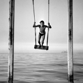 Boy on swing, Rimini, Italy, 1954