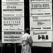 Man reading street advertisements, Moscow